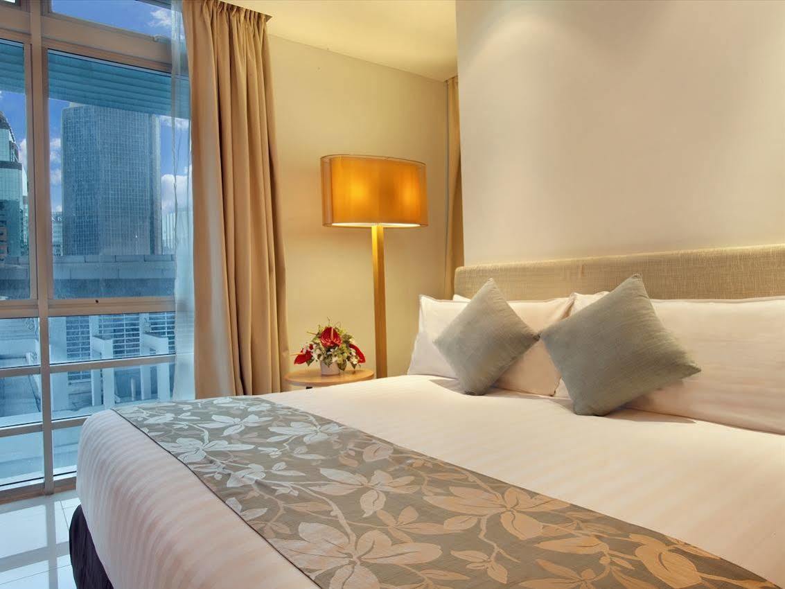 Parkroyal Serviced Suites Kuala Lumpur Exteriér fotografie A bedroom at the hotel