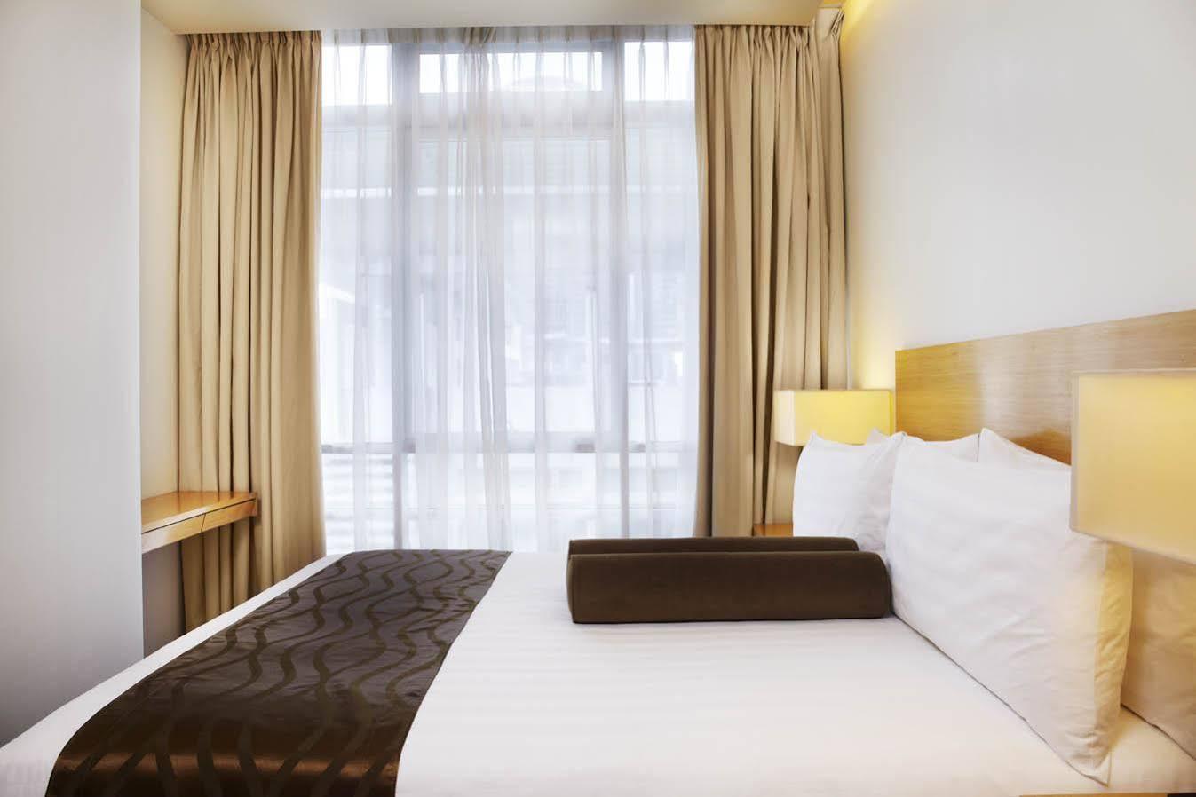 Parkroyal Serviced Suites Kuala Lumpur Exteriér fotografie A bedroom at the hotel